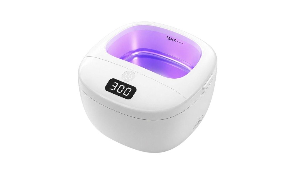 Ultrasonic cleaner with removable dental appliances including a retainer and mouth guard